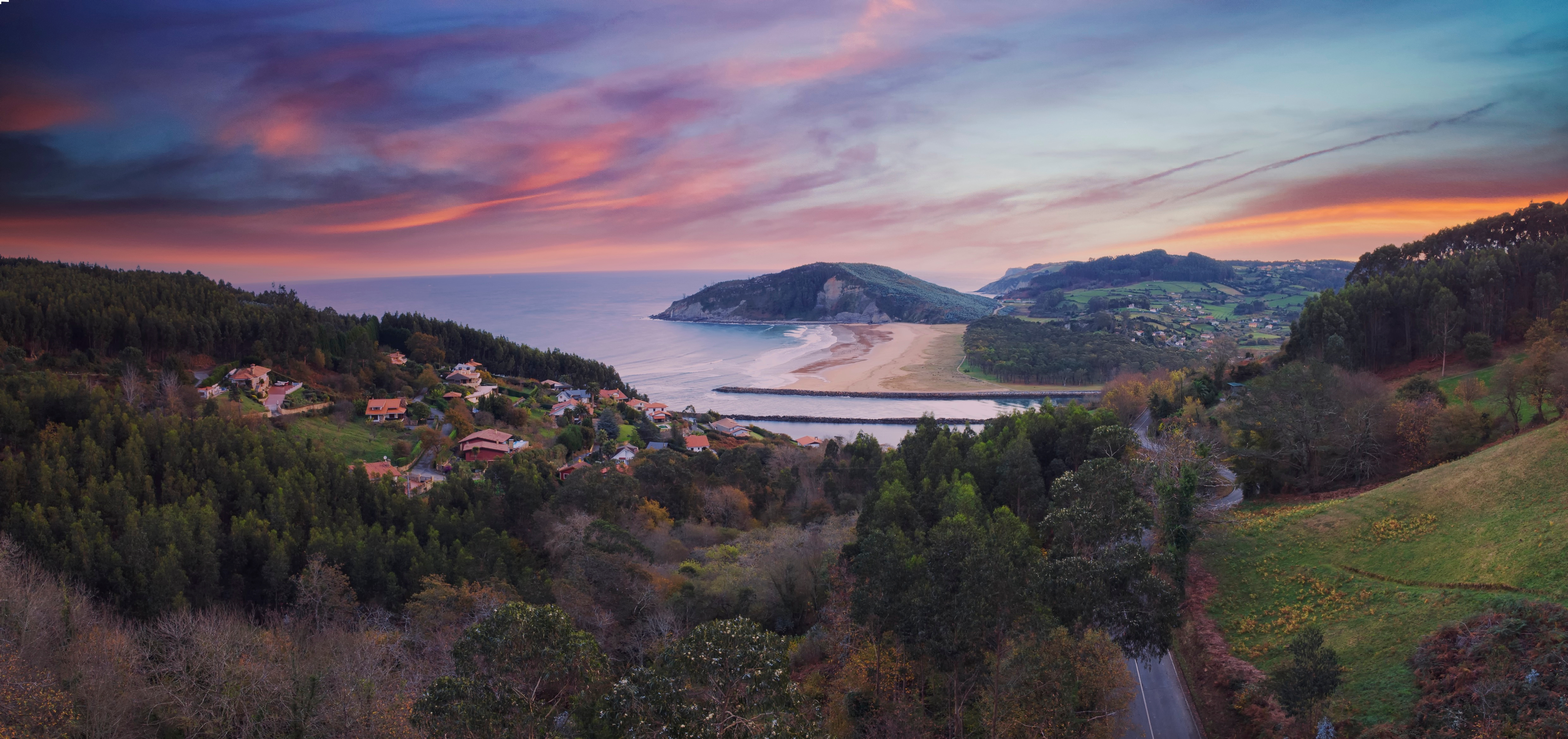 a panorama view of beautiful rodiles beach in asturias in northern spain