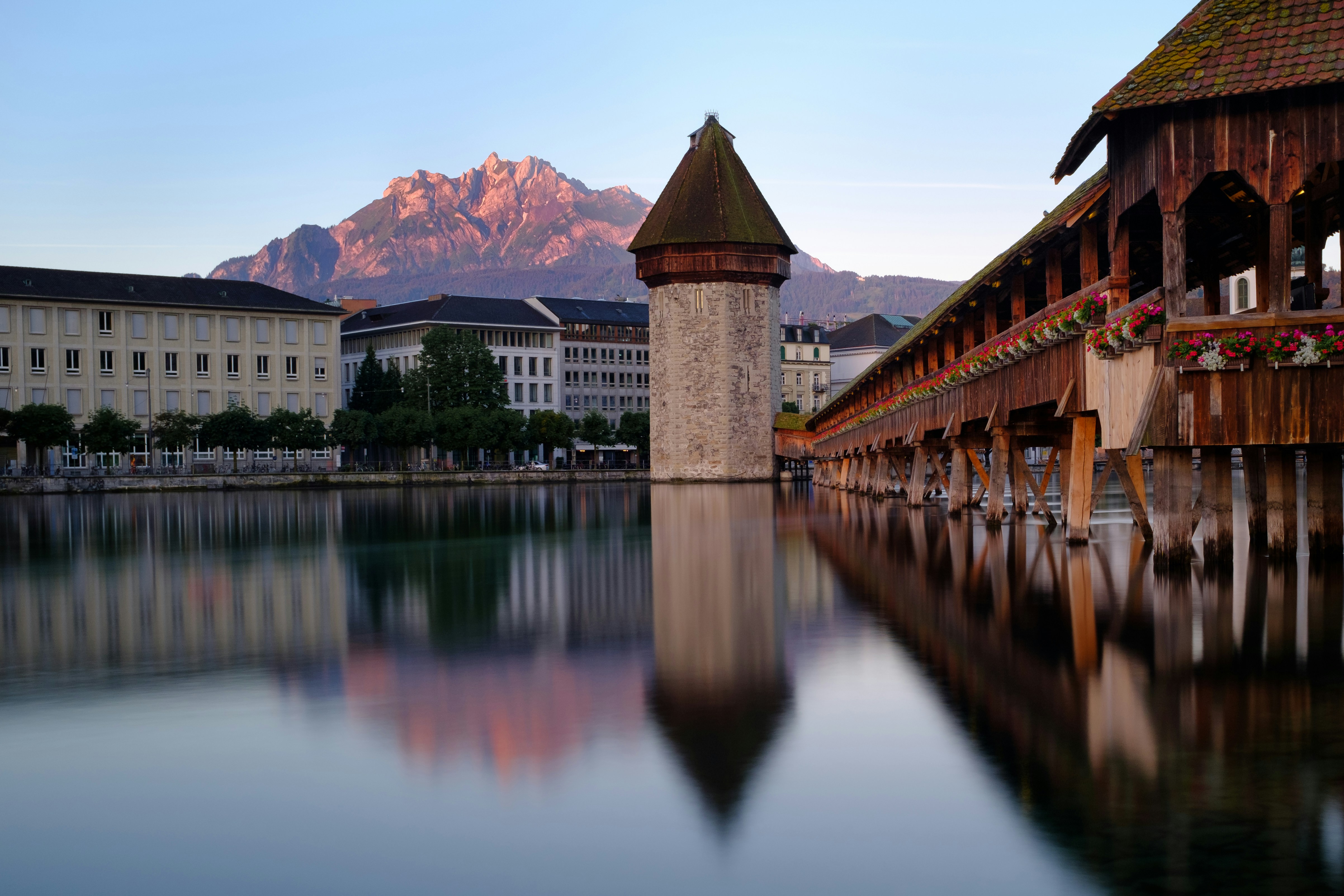 the kappelbrucke in morning light mount pilatus in the background